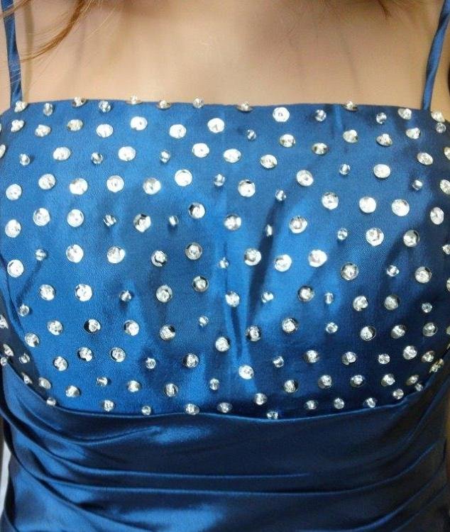 Ocean Blue prom dress has an intricate beaded bodice